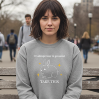 Load image into Gallery viewer, “It’s Dangerous to Go Alone” Bunny Women’s Sweatshirt